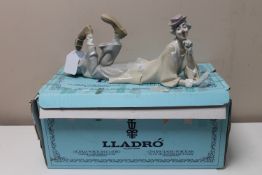 A Lladro china figure : Clown Reclining with Ball, model number 4618, designed by Salvador Furio,