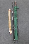 A three-piece Miter Hardy split cane fly rod in carry bag together with three further fishing rods