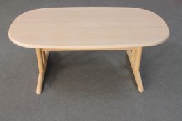 A contemporary oval coffee table