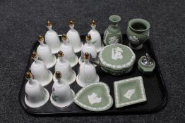 A tray containing a collection of eleven Danbury Mint china bells,