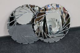 A pair of contemporary all glass fan framed mirrors