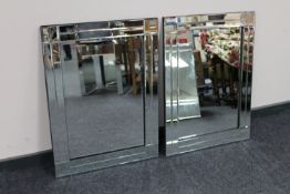 A pair of contemporary all glass rectangular mirrors