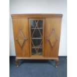 A 20th century continental oak sideboard with walnut panel doors