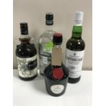 Four bottles of alcohol; a 1l bottle Greenall's Dry Gin, 70cl bottle of The Kraken Black Spiced Rum,