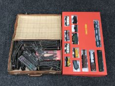 A boxed Hornby railways train set together with a vintage leather case containing track