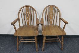 A pair of continental oak Windsor armchairs