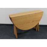 An Ercol elm gateleg table