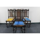 A set of four antique oak barley twist bergere back dining chairs