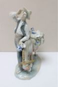 A Lladro figure of a pottery salesman with donkey