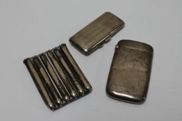 A silver cheroot holder Birmingham 1894, together with two silver cigarette cases.