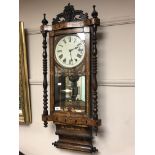 A Victorian rosewood and parquetry inlaid wall clock with enamelled dial, 41 cm.