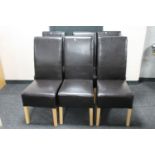 A set of six leather high back dining chairs