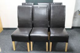 A set of six leather high back dining chairs
