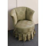 A mid 20th century bedroom chair in green brocade