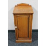 An Edwardian satinwood pot cupboard