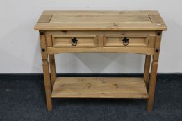 A Mexican pine two drawer hall table