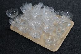 A tray of antique and later drinking glasses together with a set of six glass grapefruit dishes