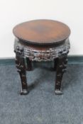 A 20th century carved Chinese plant stand