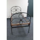 A Victorian cast iron 3' bed frame with box spring