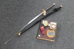An antiquarian volume, Great Thoughts, together with a vintage AA badge, a replica Samurai sword,