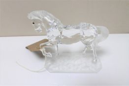 A (Swarovski?) crystal figure of a trotting horse