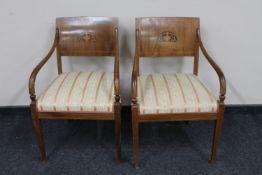 A pair of continental inlaid mahogany armchairs