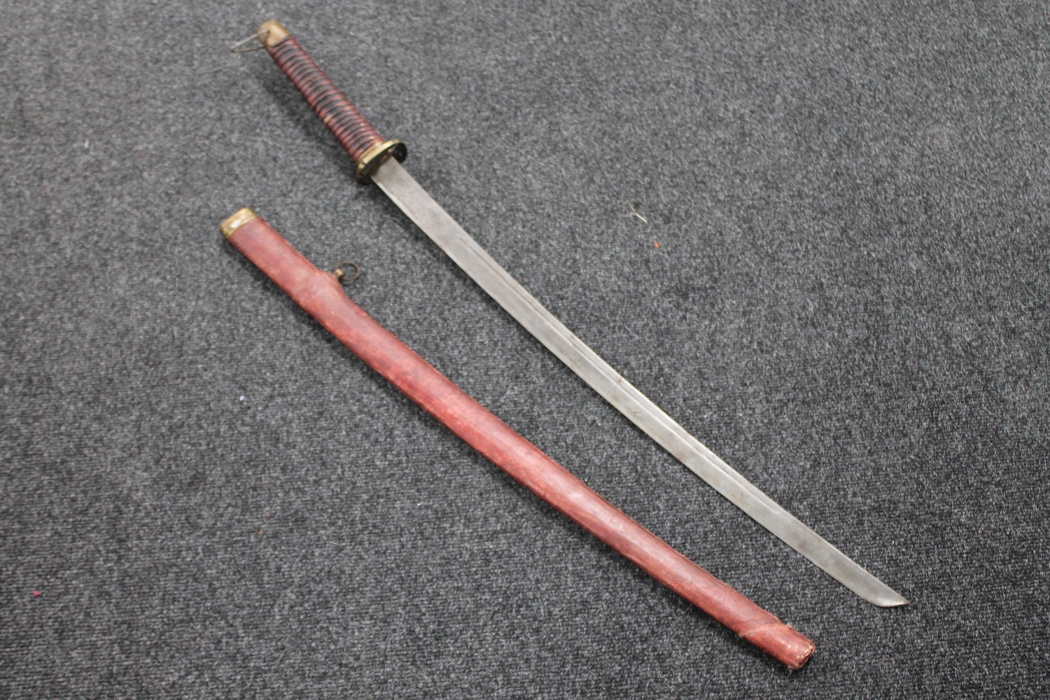 A reproduction Japanese katana in scabbard