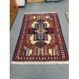 A Caucasian rug of geometric design 180 cm x 122 cm