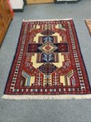 A Caucasian rug of geometric design 180 cm x 122 cm