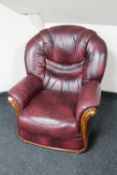 A Burgundy leather armchair