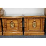 A pair of oriental style parcel gilt two drawer bedside chests