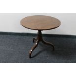 A Victorian mahogany circular tilt top pedestal occasional table