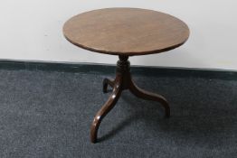 A Victorian mahogany circular tilt top pedestal occasional table