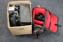 A camera bag containing a Chinon camera with lens and flash,