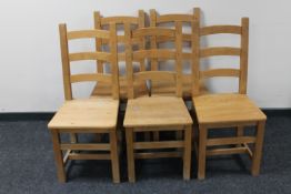 A set of five pine ladder back kitchen chairs