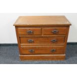 An Edwardian pine four drawer chest