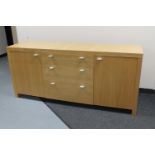 A contemporary oak veneered sideboard