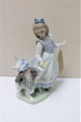 A Lladro figure of Alice in Wonderland 5740 (a/f) CONDITION REPORT: Loss to the