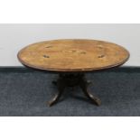 A Victorian inlaid mahogany pedestal occasional table