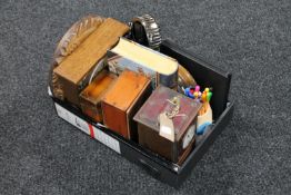 A box containing wooden barometer, mantel clocks,