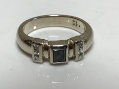 A 14ct white gold sapphire and diamond ring,