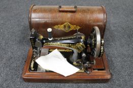 A mid 20th century oak cased Singer sewing machine