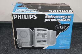 A boxed Philips micro hifi system