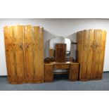 A five piece 1930's walnut bedroom suite comprising of lady's and gent's wardrobes,