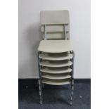 A set of six plastic 20th century stacking school chairs on metal legs