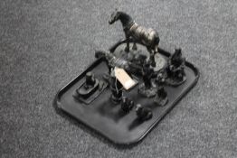 A tray containing nine carved coal figures of miners, miner's lamp,