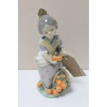 A Lladro figure of a Spanish girl with oranges