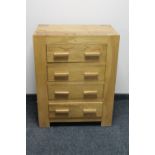 A contemporary oak four drawer chest