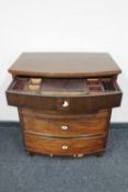An antique continental bow-fronted secretaire chest