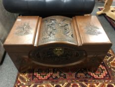 An Oriental carved camphor wood chest, width 93 cm.